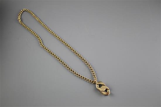 An unmarked heavy gold (tests as 9ct) curblink chain with large double curblink pendant, gross weight 95.9 grams.